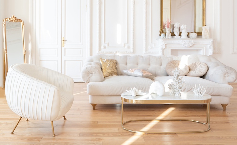 Very Light Baroque Style Luxury Interior Of Big Sitting Room. White Walls Decorated With Awesome Stucco. Royal Style Apartment With Chic Furniture With Gold Elements